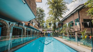 2 outdoor pools, open 7:00 AM to 10:00 PM, pool umbrellas, pool loungers