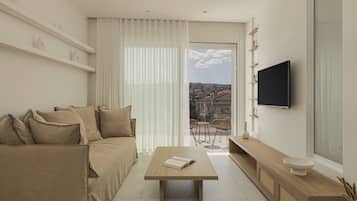 Deluxe Suite, Balcony, City View | Living area