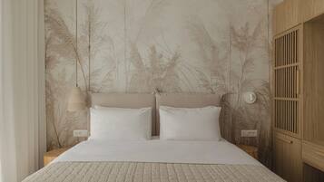 Suite Deluxe, balcon, vue ville | Surmatelas, coffres-forts dans les chambres