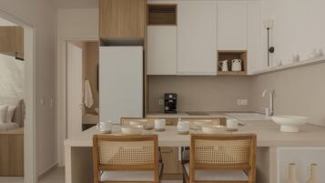 Deluxe Suite, Balcony, City View | Private kitchen | Full-size fridge, oven, stovetop, cookware/dishes/utensils