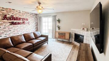 TV, fireplace, books