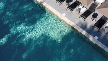 Seasonal outdoor pool, pool umbrellas, pool loungers