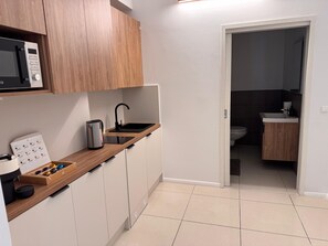 Fridge, microwave, stovetop, coffee/tea maker