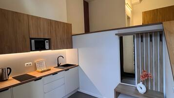 Fridge, microwave, stovetop, coffee/tea maker