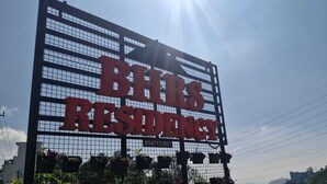 A large sign for BHR's Residence with a grid pattern and a contact number. - Affordable garden view stay in misty Munnar
Free Wi‑Fi, breakfast, parking (Bison Valley)