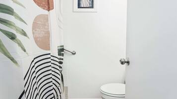Shower, hair dryer, towels, shampoo