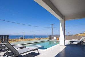 Seasonal outdoor pool, pool umbrellas, pool loungers