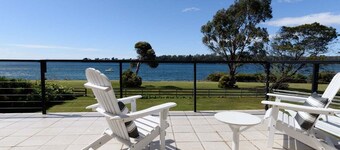 Sunset Sanctuary: Waterfront Home with Balcony and Patio