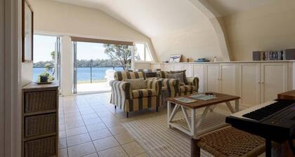 Sunset Sanctuary: Waterfront Home with Balcony and Patio