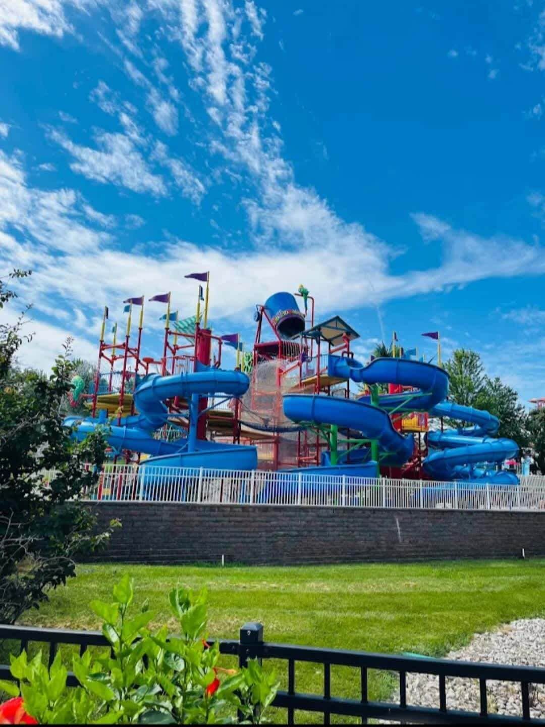 A water park with multiple slides and a central structure.