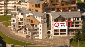 A multi-story residential building with a prominent sign indicating 'No Parking' and 'Studio 4 places'. - Studio for 4 in Gourette, southwest balcony, pets allowed (Gourette)