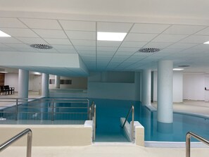 An indoor swimming pool with a clear view of the pool area, including the pool's edge, steps, and railings. - Studio for 4 in Gourette, southwest balcony, pets allowed (Gourette)