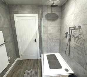 Shower, eco-friendly toiletries, hair dryer, towels