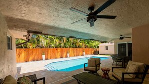 A covered outdoor area with a pool, patio furniture, and a ceiling fan. - ‼️Poolside Miami Paradise w/ BBQ + Outdoor Lounge (Miami)