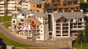 A modern apartment complex with multiple buildings, balconies, and solar panels. - Gourette: Apartment 6 ppl, 57m², Pets allowed, Pool (Gourette)
