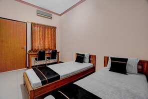 غرفة ديلوكس بسريرين منفصلين | واي فاي مجانًا وملاءات أسرّة