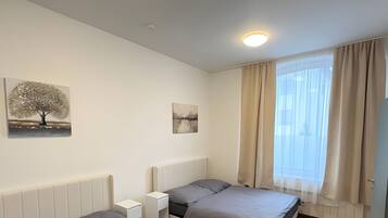 1 habitación, tabla de planchar con plancha, wifi y ropa de cama