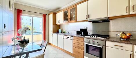 Microwave, dishwasher, coffee/tea maker, cookware/dishes/utensils