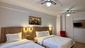 Standard Triple Room, Courtyard View | In-room safe, desk, laptop workspace, free WiFi