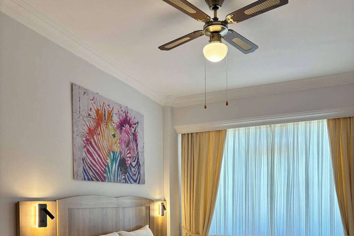 Deluxe Double Room, City View | Minibar, in-room safe, desk, laptop workspace
