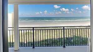 A balcony with a view of the beach and ocean. - Windjammer 215 | Balcony Views + Resort Amenities (St. Augustine)