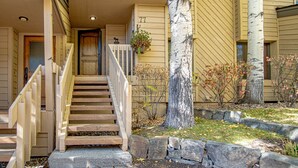 A wooden staircase leading to a front door, a stone pathway, and a tree with a white bark. - Ridge Condo - Luxury Condo W/resort Amenities (Sun Valley)