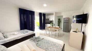 Studio, Balcony, Poolside | Private kitchen | Fridge, stovetop, coffee/tea maker, cookware/dishes/utensils