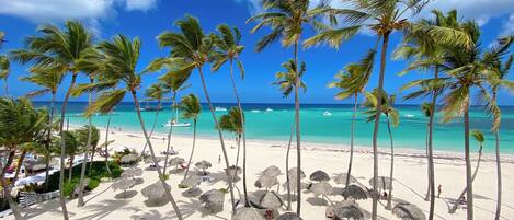 On the beach, white sand, beach towels, beach massages