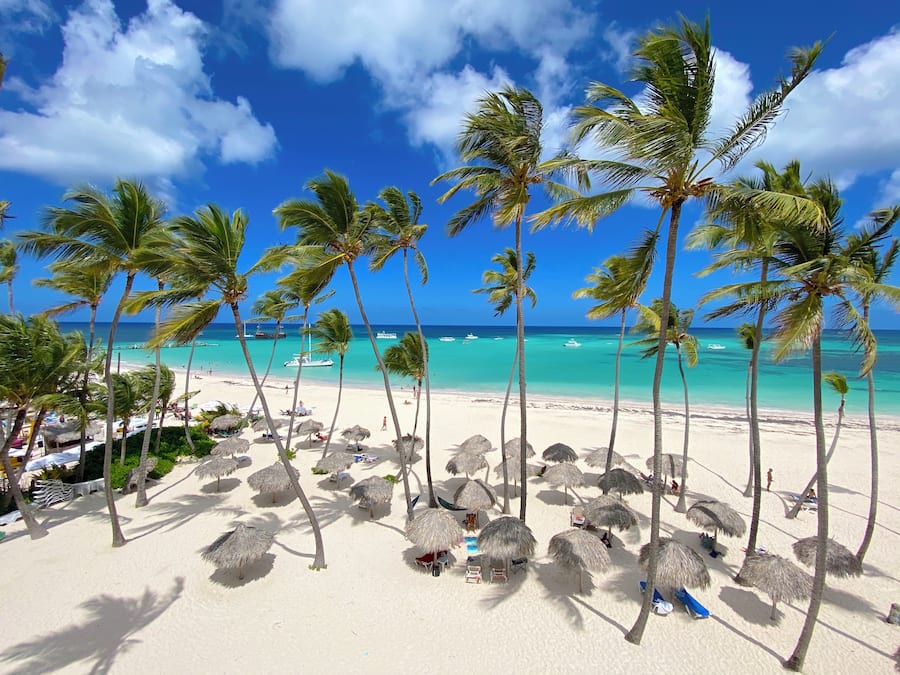 On the beach, white sand, beach towels, beach massages