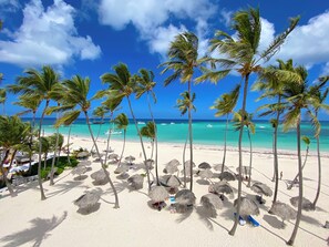 On the beach, white sand, beach towels, beach massages - CARIBBEAN Ocean Breeze Beach HOTEL (Punta Cana)