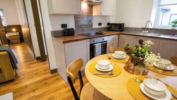 Fridge, microwave, toaster, cookware/dishes/utensils