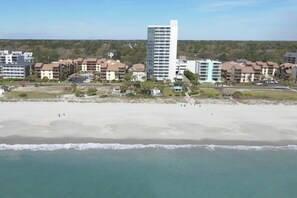 A coastal hotel with multiple buildings, a sandy beach, and ocean views. - Forest Dunes 204- Side Ocean View 1 Bedroom- Pool (Myrtle Beach)