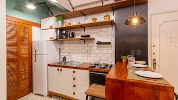 Fridge, microwave, stovetop, coffee/tea maker