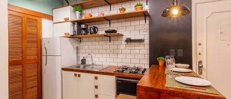 Fridge, microwave, stovetop, coffee/tea maker