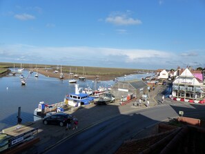 A coastal town with a marina, boats, and a building labeled 'CHANDLERY'. - 6 The Granary - sleeps 2 guests  in 1 bedroom (Wells-next-the-Sea)