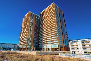 A high-rise hotel with multiple balconies and a modern architectural design. - Phoenix Gulf Towers 1206 (Orange Beach)