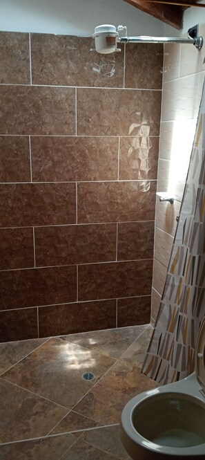 Basic Double Room | Bathroom | Shower, towels, soap, toilet paper