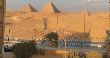 Stylish Apartment with Stunning Pyramid View — Steps from Grand Egyptian Museum