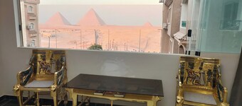 Stylish Apartment with Stunning Pyramid View — Steps from Grand Egyptian Museum