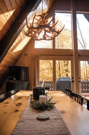 Dining - 🔥 Cozy Bellaire A-Frame | Golf • Torch • Brew 🍻<br>Nestled in Schuss Mountain Resort—close to Golf, Torch Lake 💙, and downtown Bellaire’s famous Short’s Brewery. Stay, play, and unwind by the fire pit under Northern Michigan skies 🌲✨ (Bellaire)