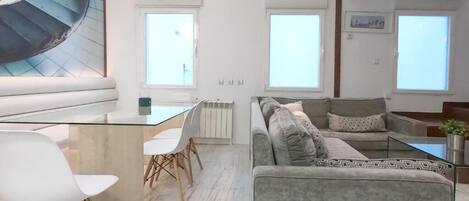 Deluxe Apartment | Living area | Flat-screen TV