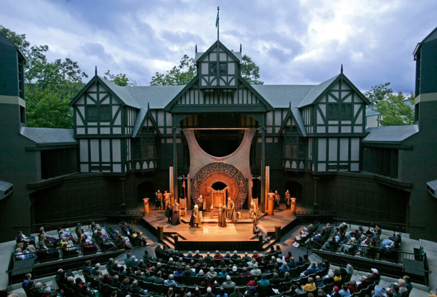 A theater with a stage and audience seating.