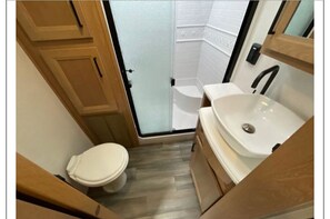 Shower, towels, soap, toilet paper