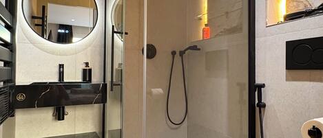 Shower, hair dryer, towels, soap