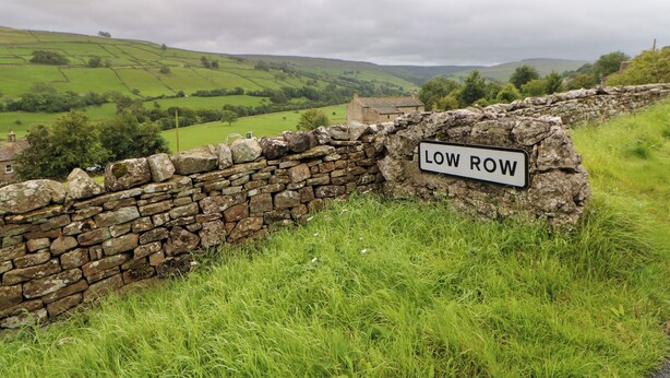 A stone wall with a sign reading "LOW ROW". - Nick Jone (Richmond)