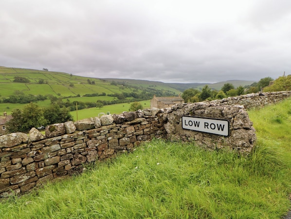 A stone wall with a sign reading "LOW ROW". - Nick Jone (Richmond)