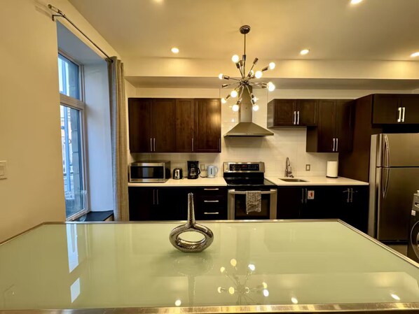 Family Apartment, City View | Private kitchen | Full-size fridge, microwave, oven, stovetop - AirStay-Bishop (Montréal)