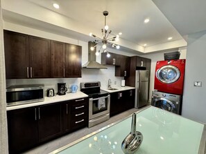 Family Apartment, City View | Private kitchen | Full-size fridge, microwave, oven, stovetop - AirStay-Bishop (Montréal)