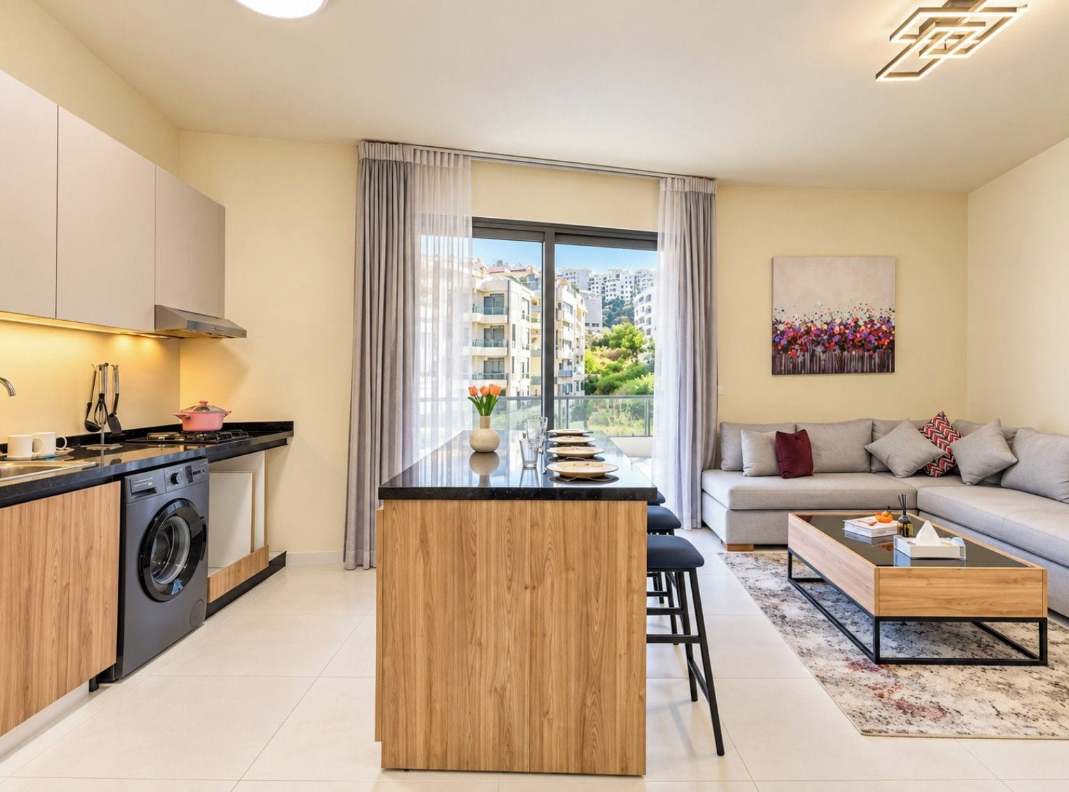 A modern apartment with a kitchen, dining area, and living room.
