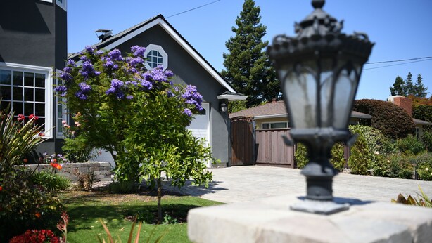 A residential house with a well-maintained lawn, a wooden gate, and a stone lamp post. - Private In-Law Suite with Kitchenette in Sunnyvale next to Park (Sunnyvale)